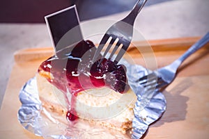 Blueberry cheese cake in white dish on the wood