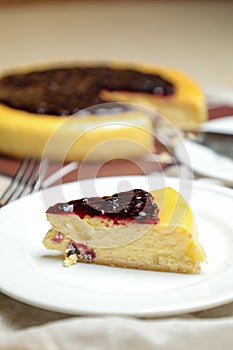 Blueberry Cheesecake slice include caramel with fork and knife served in plate isolated on table top view of cafe bake food