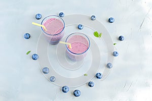 Blueberry Fresh and Cold Smoothie in Glasses Heart shape berries around