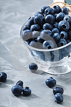 Blueberry gray background. Close-up, ripe blueberry berries on a gray background ecological packaging. Delivery of