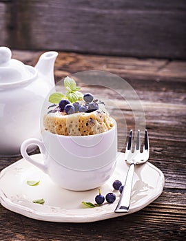 Blueberry Microwave Muffin in mug . Selective focus