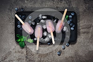 Blueberry mojito popsicles. Refreshing frozen cocktail