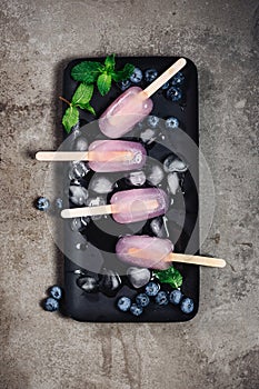 Blueberry mojito popsicles. Refreshing frozen cocktail