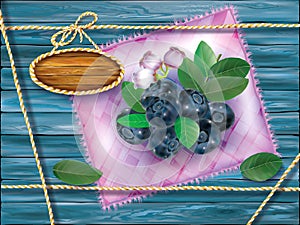 Blueberry on motley cloth and wooden background