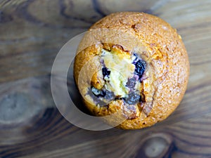 Blueberry muffin on rustic wooden background