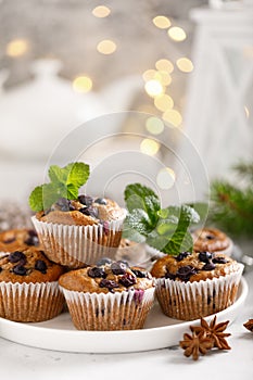 Blueberry muffins with fresh berries and Christmas, Xmas or New Year decorations