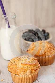 Blueberry Muffins With Glass Jug of Milk