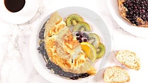 Blueberry omelet and coffee