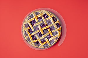 Blueberry pie in a tray with a lattice crust. Classic american pie