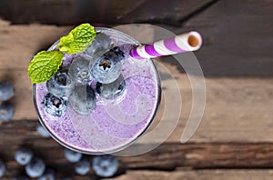 Blueberry smoothie purple colorful fruit juice milkshake blend beverage healthy.
