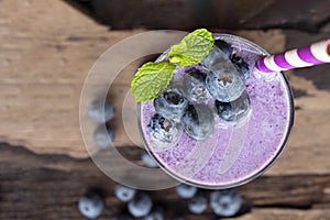 Blueberry smoothie purple colorful fruit juice milkshake blend beverage healthy .