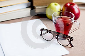 Blueberry tea to strengthen vision with empty white paper, eyeglasses