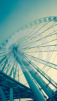 Blueish toned image of a large ferris wheel