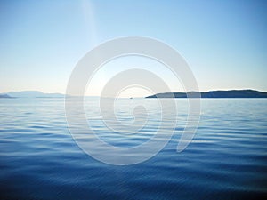 Blueness of Ionian sea and islands and ray of light photo