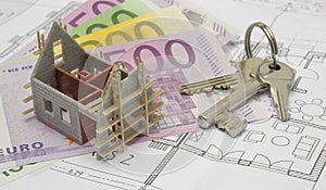 Architectural plan with euro banknotes and house keys