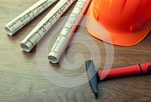 Blueprint rolls and set of construction tools