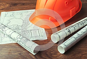 Blueprint rolls and set of construction tools