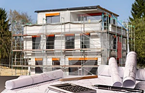 Blueprints and shell construction on a construction site