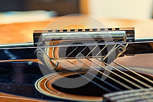 A blues harmonica and acoustic guitar