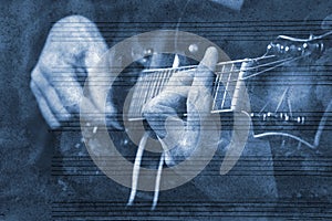 Blues music concept. guitarist playing blues. guitarist on the background of the sheet music. music sheet painted with blue waterc