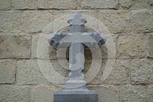 Bluestone cross against a sandstone background