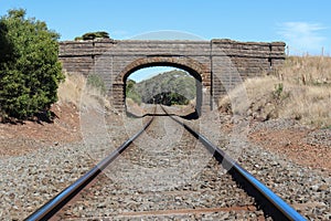 The bluestone Navigators-Dunnstown Road railway bridge 1860 was constructed by stonemasons with basalt quarried from Lethbridge