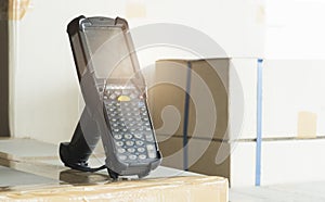 Bluetooth barcode scanner on shipment boxes, Manufacturing cargo warehouse export. Computer equipment for inventory management.