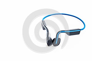 Bluetooth headphones lie on white background, technology progress concept.