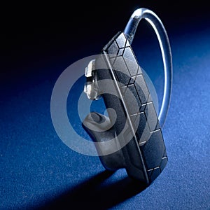 Bluetooth Headset on blue background photo