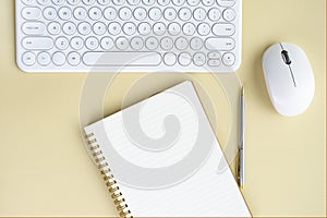 Bluetooth keyboard and office environment on beige background