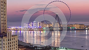 Bluewaters island with modern architecture and ferris wheel aerial day to night timelapse.