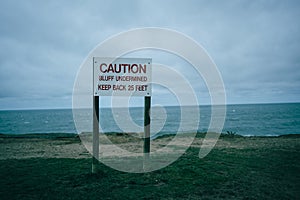 Bluff Undermined sign on cliffs, Montauk, New York photo