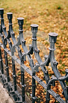 Blunt tips of metal tops of a forged fence