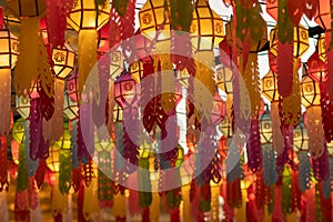 Blur background Lantern Festival in Lamphun Province of Thailand is decorated with Lanna style paper lanterns during Loy Krathong