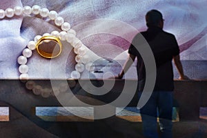 Blur background shadow rear of man the front is the sea and the sky thinking of something that is happy, Rings and marriages.