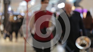 Blur background of shopping mall and crowd of