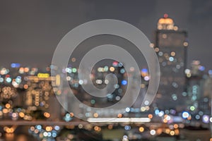 Blur city background rooftop view of Bangkok cityscape business building landscape night lights bokeh