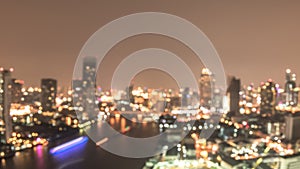 Blur city background rooftop view of Bangkok cityscape business building landscape night lights bokeh