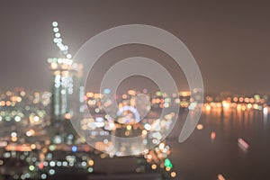 Blur city background rooftop view of cityscape business building landscape night lights bokeh in vintage tone