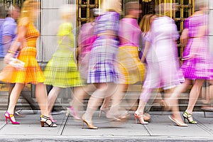 Blur of Colorful Dresses and Heels in Motion on City Sidewalk - Capturing the Urban Pace and Women\'s Fashion