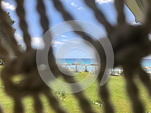 Blur Front Net and Focus on the Deck Chairs on The Beach