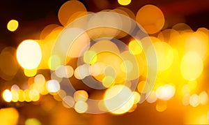 Blur gold color bokeh background. Blur abstract background of city light. Warm light with beautiful pattern of round bokeh. Orange