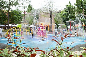 Blur image of children's water fun park at public playground