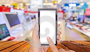 blur image of eletronic department store for background usage photo