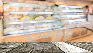 Blur image of people in bakery shop for background usage