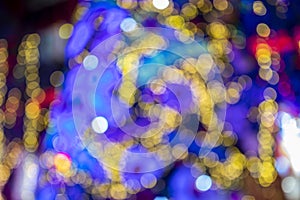 Blur light celebration on christmas tree, happy new year colorful background