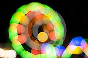 Blur light of ferris wheel background