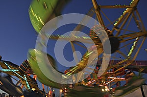 Blur motion of amusement park ride at night