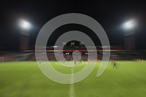 Blur motion of soccer football sport stadium night scene use for