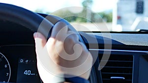 Blur motion of a woman driving on the road and listening to music with